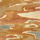 Handknotted rug in an abstract watercolor design in shades of orange, tan, cream and grey. 