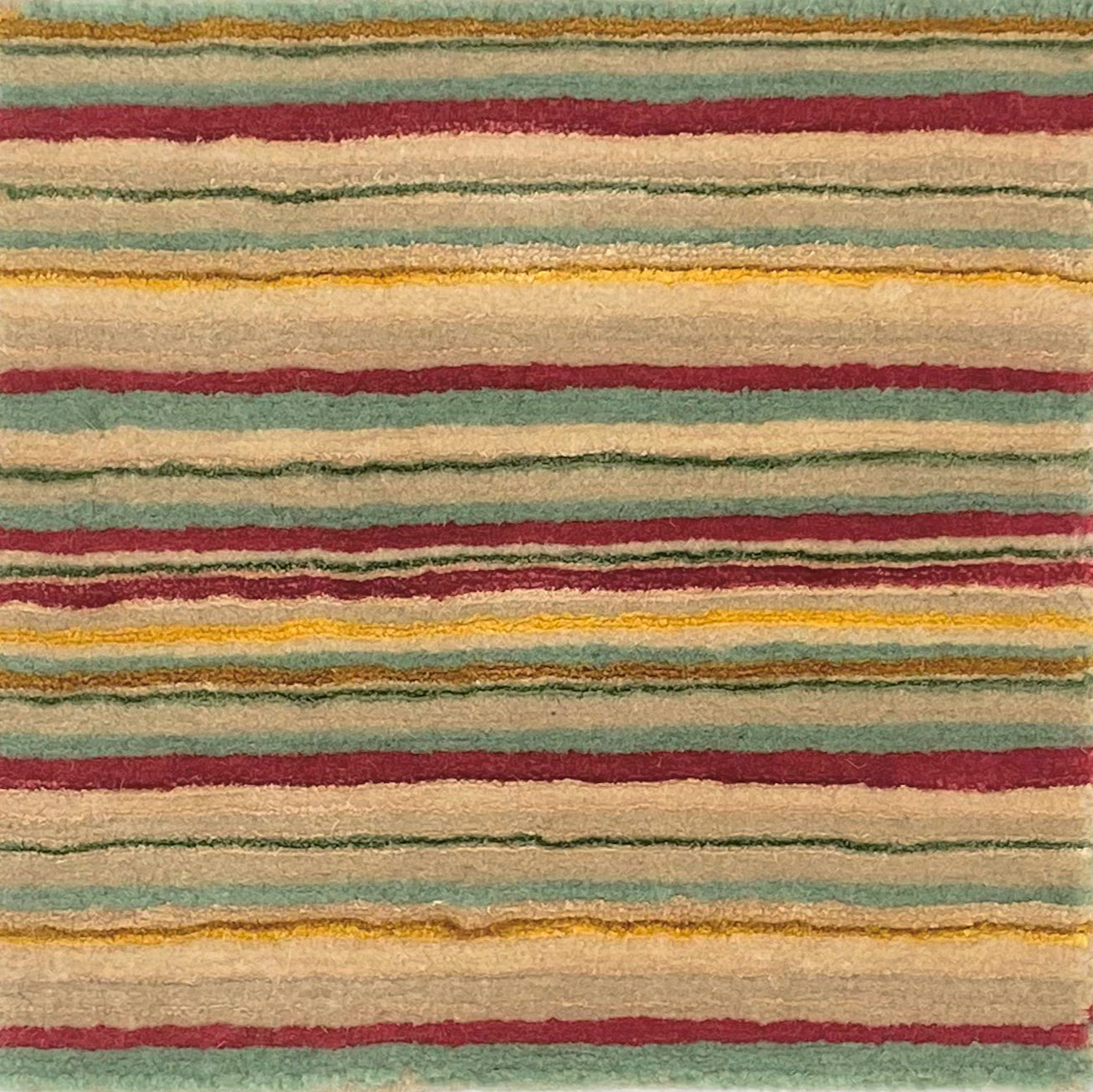 Handknotted rug sample in thin stripes of red, green , yellow and beige.