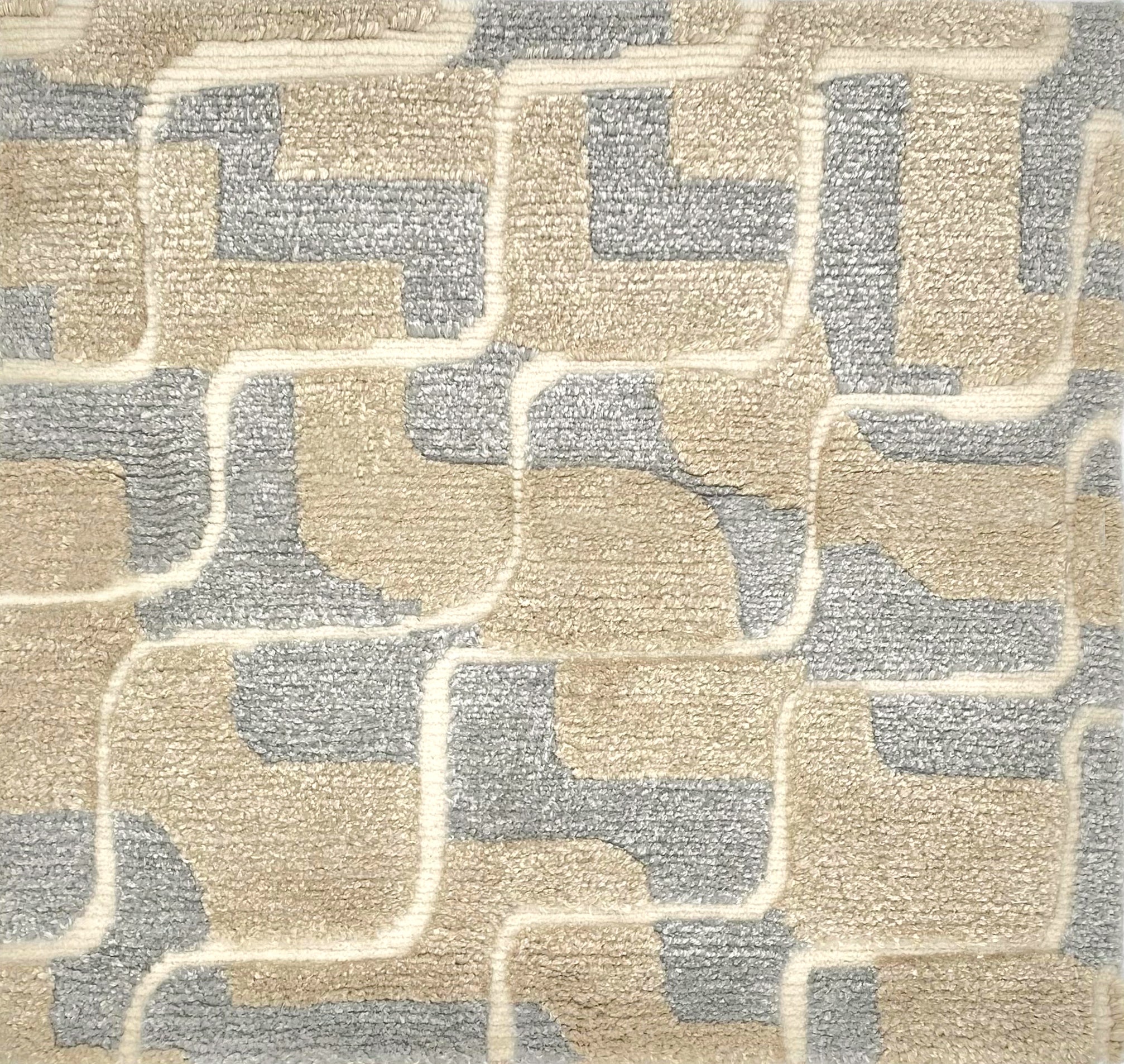 Handknotted rug in a contemporary ripple design in silver, champagne and cream.