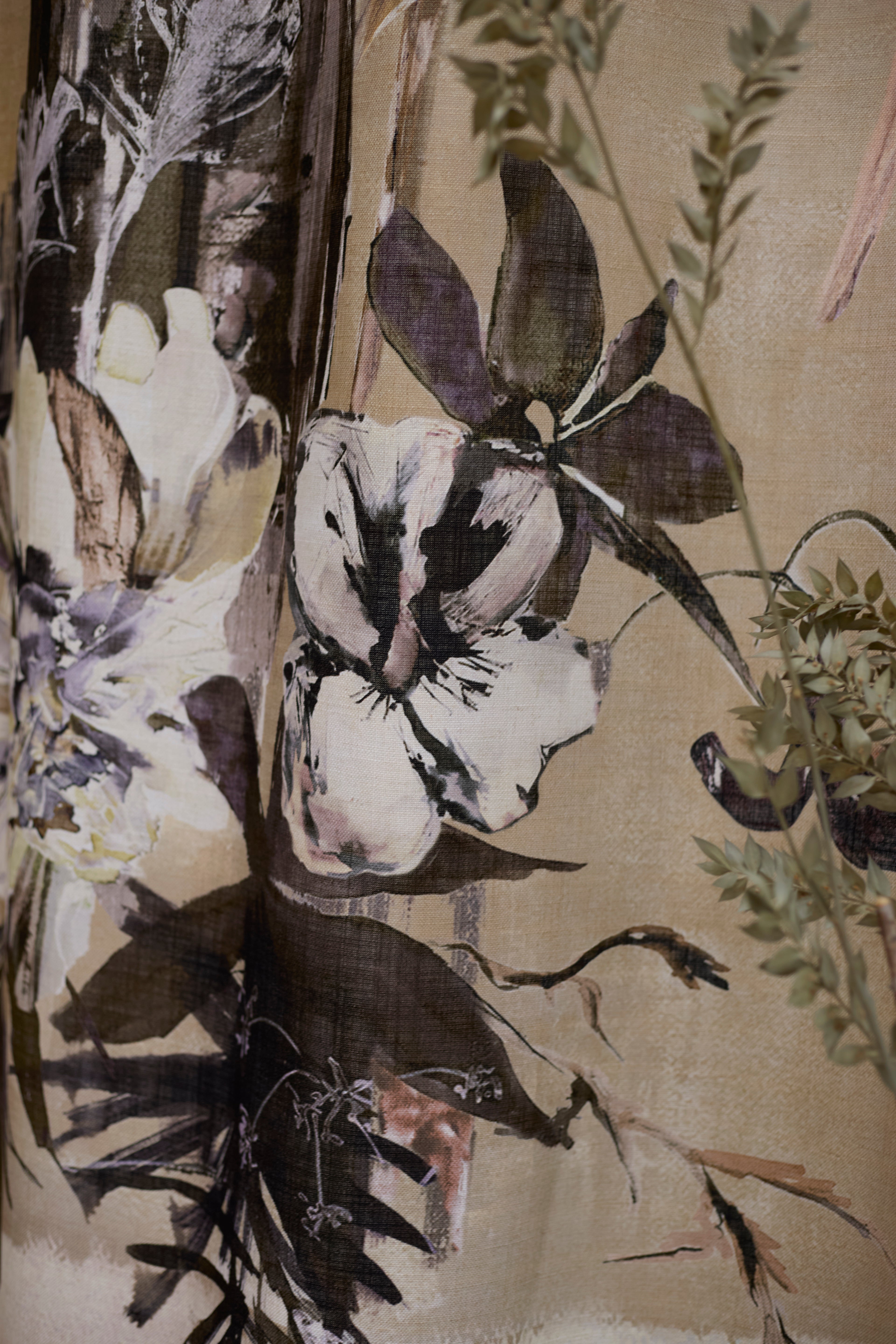 Detail of a watercolor floral mural in black and white on a sepia field 
