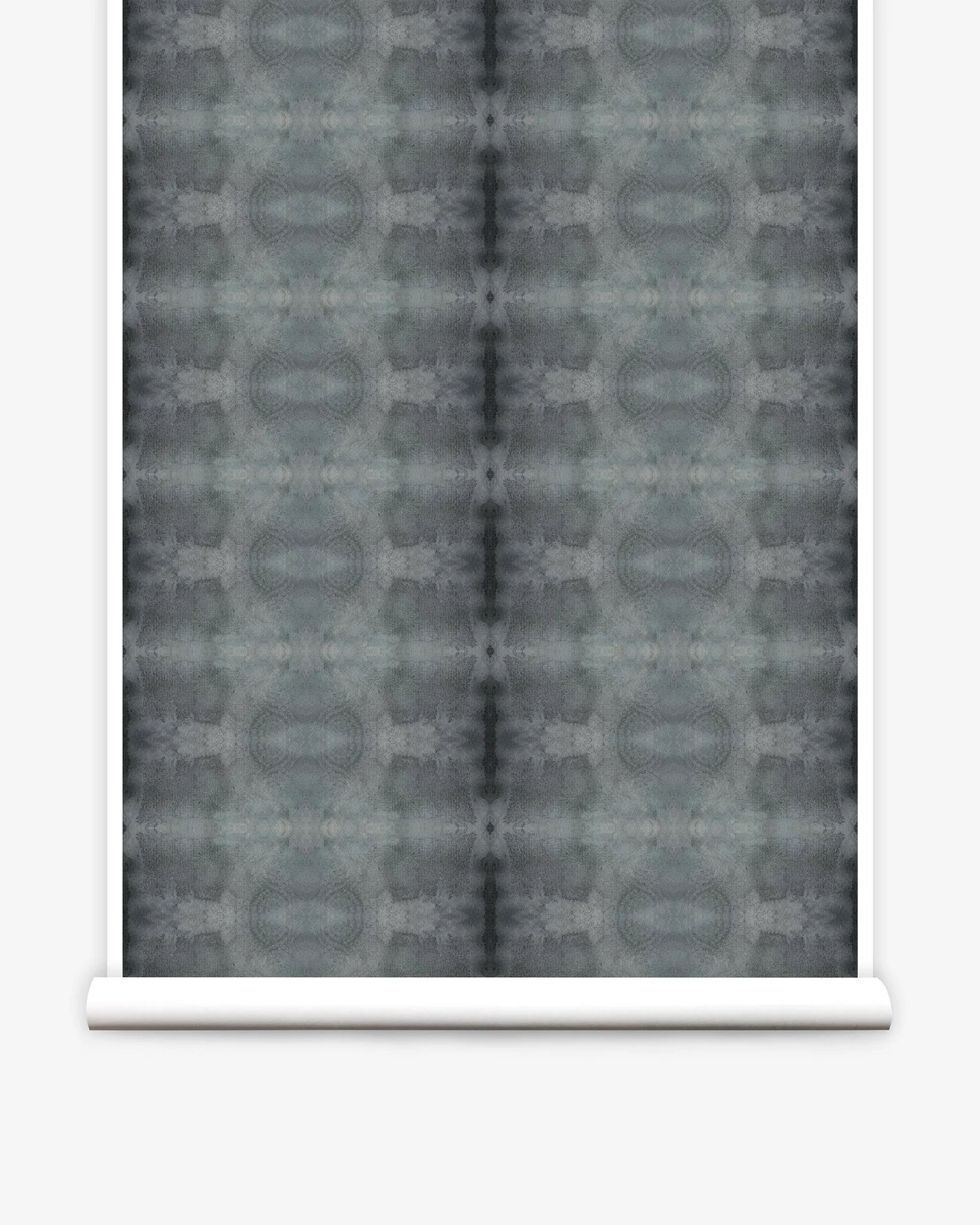 Partially unrolled wallpaper yardage in a repeating ink blot print in shades of gray.