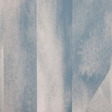 Detail of wallpaper in a linear geometric print in shades of blue and gray.