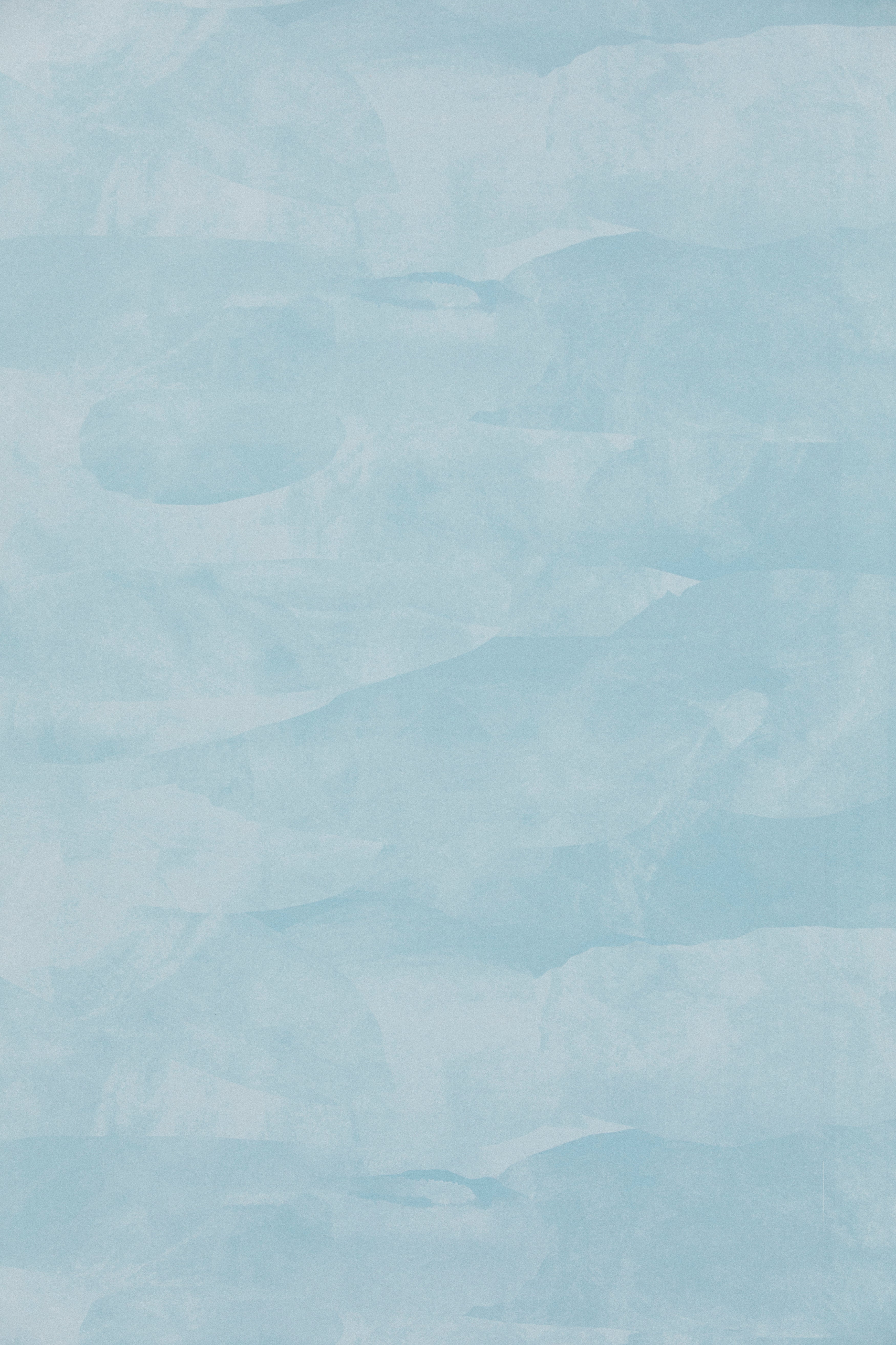 Detail of wallpaper in an abstract textural pattern in shades of white and blue.