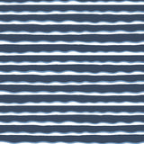 Detail of fabric in an undulating stripe pattern in blue and white on a navy field.