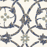 Detail of fabric in a floral lattice print in mottled tan and blue on a white field.