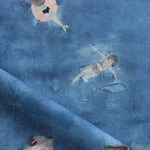 Fabric with watercolor characters swimming on a blue background