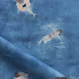 Fabric with watercolor characters swimming on a blue background