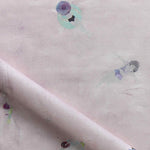 Fabric with watercolor characters swimming on a light pink background