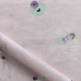 Fabric with watercolor characters swimming on a light pink background