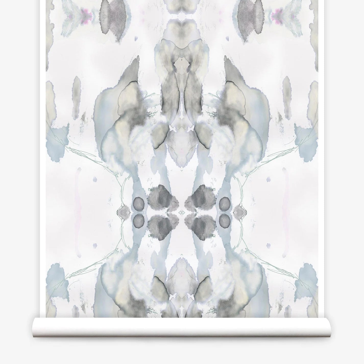 Partially unrolled wallpaper yardage in a watercolor paint blotch print in shades of gray and blue on a white field.