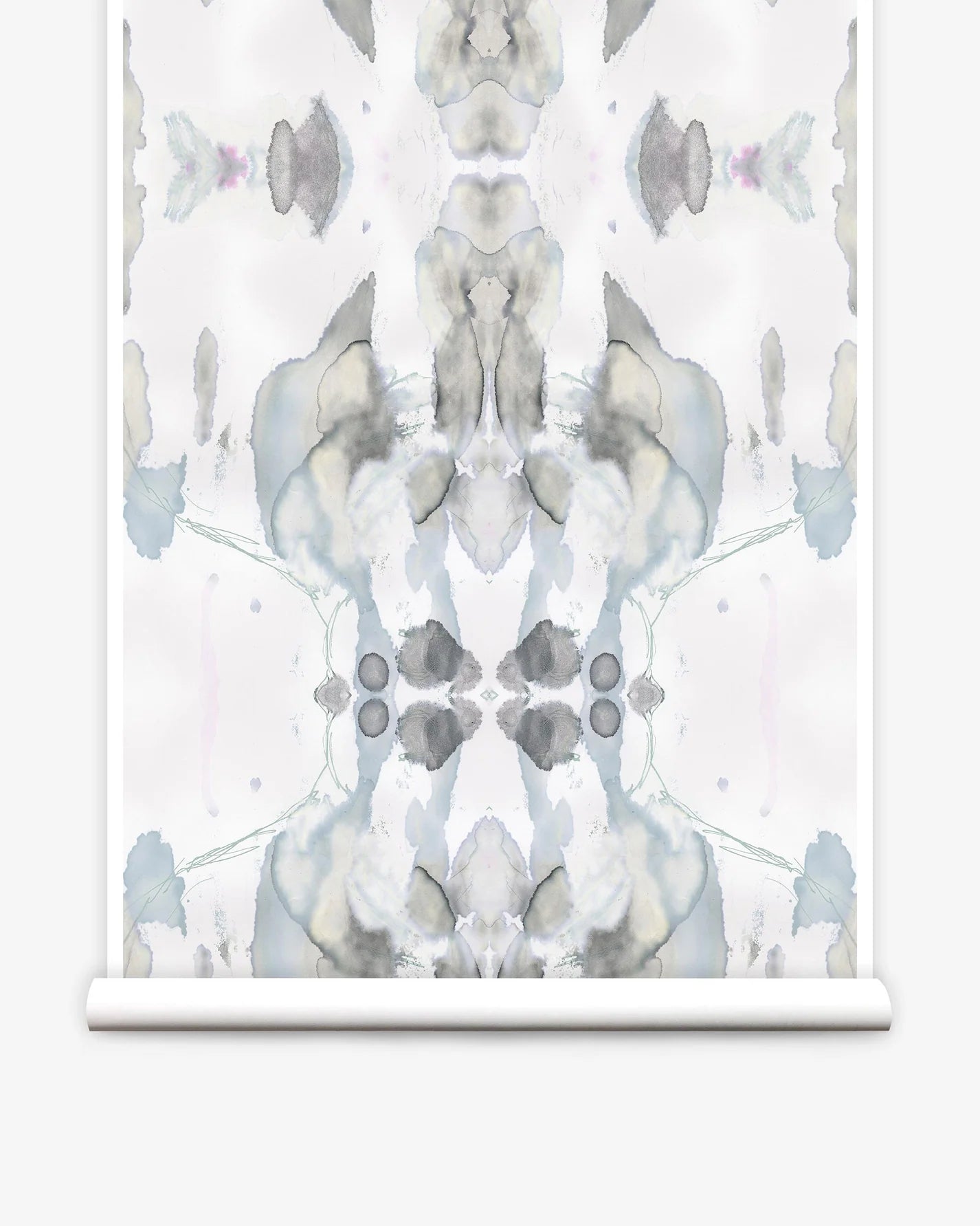 Partially unrolled wallpaper yardage in a watercolor paint blotch print in shades of gray and blue on a white field.
