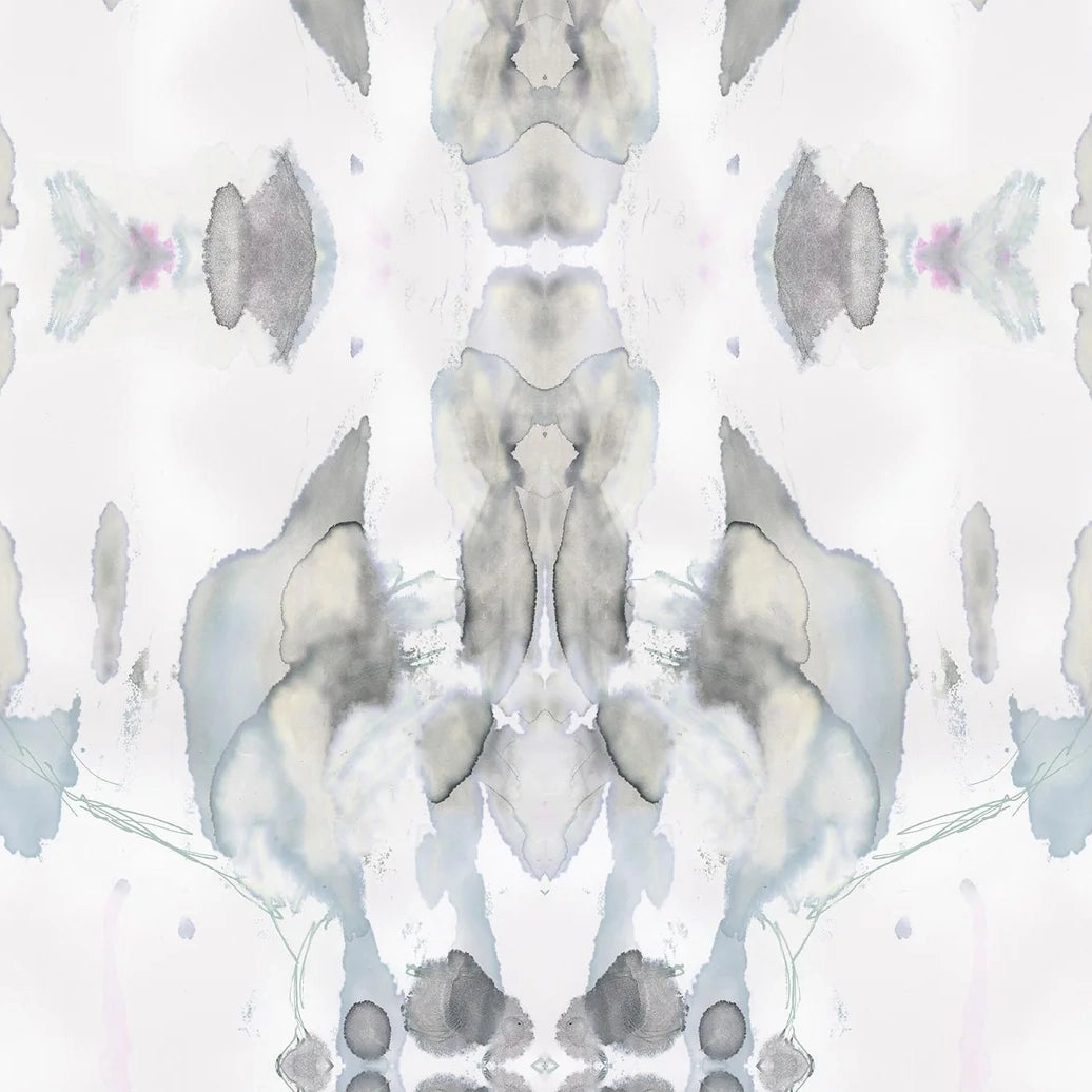 Detail of wallpaper in a watercolor paint blotch print in shades of gray and blue on a white field.