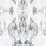 Detail of wallpaper in a watercolor paint blotch print in shades of gray and blue on a white field.
