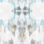 Detail of wallpaper in a watercolor paint blotch print in shades of gray, blue and tan on a white field.