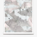 Roll of wallpaper with abstract watercolor design in shades of grey. 