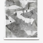 Roll of wallpaper with abstract watercolor design in shades of grey. 