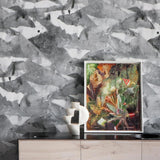 Framed artwork on a wooden surface with a watercolor gray wallpaper in the background