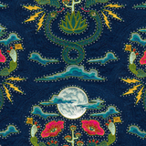 Detail of fabric in a playful snake, plant and moon print in jewel tones with rhinestone accents on a navy field. 