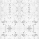 Detail of wallpaper in a watercolor ink blot print in gray on a white field.