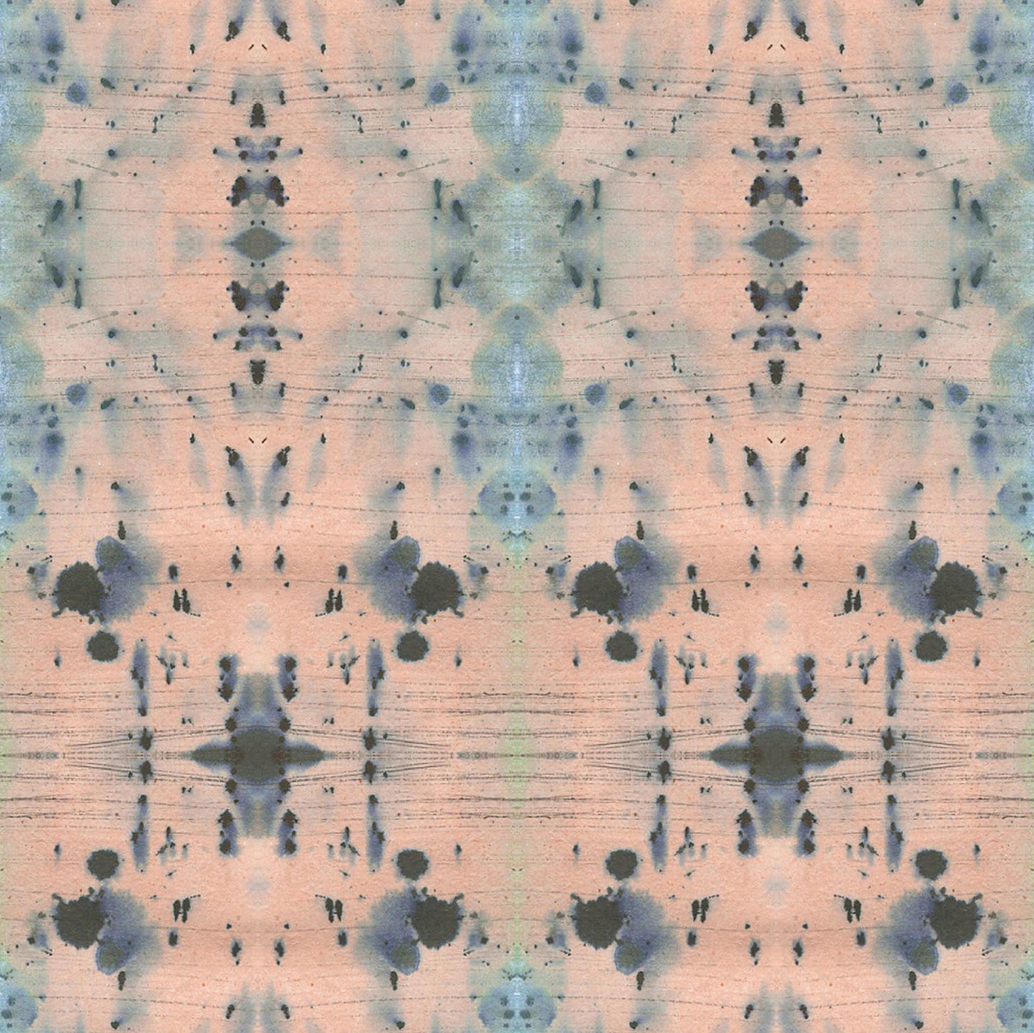 Detail of wallpaper in a watercolor ink blot print in blue and gray on a light pink field.