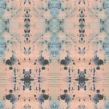 Detail of wallpaper in a watercolor ink blot print in blue and gray on a light pink field.