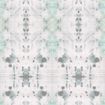 Detail of wallpaper in a watercolor ink blot print in gray and green on a cream field.