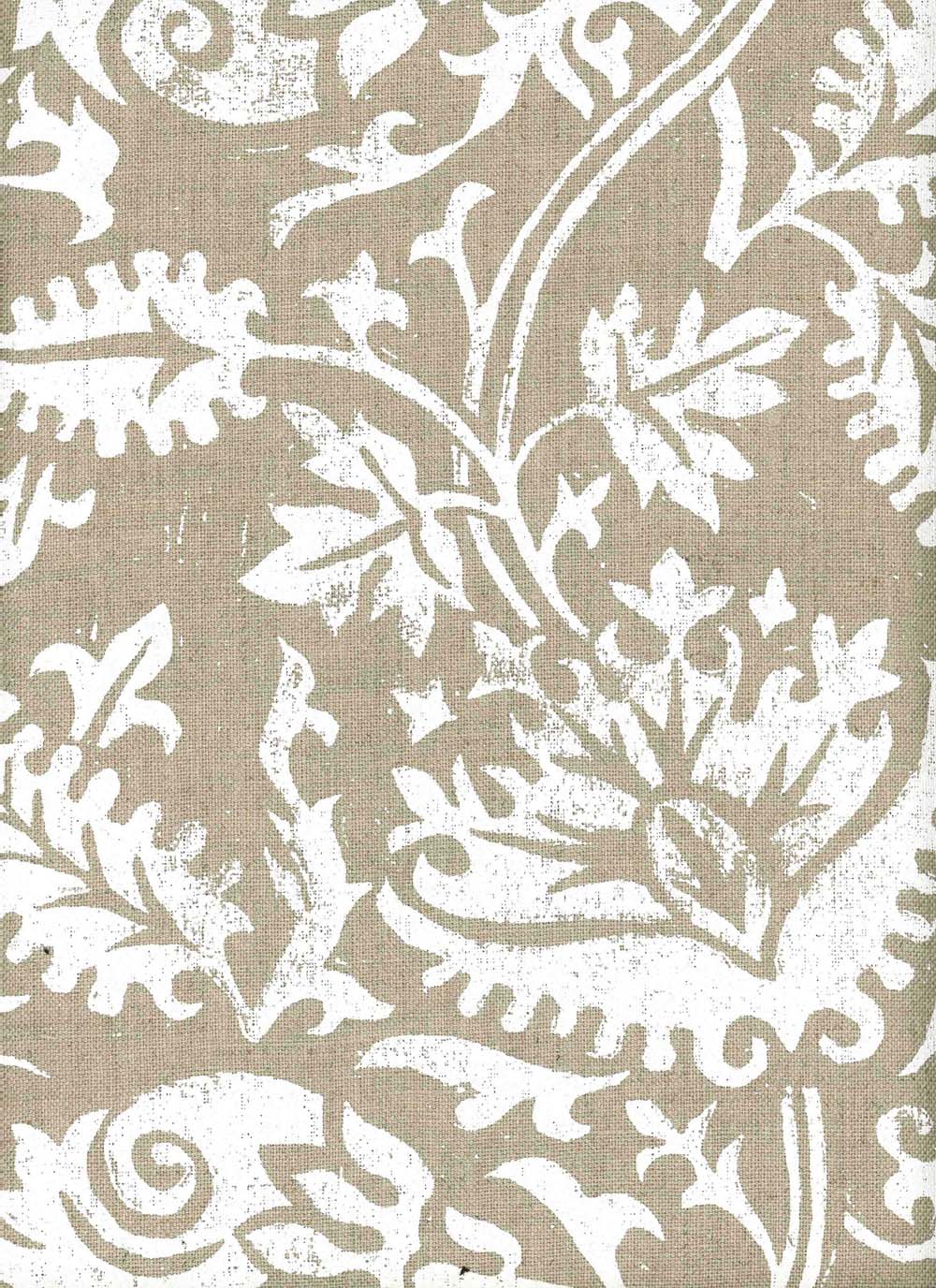 Detail of fabric in a floral damask print in white on a light brown field.