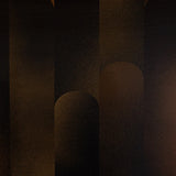 Detail of wallpaper in a curvilinear geometric print in shades of black and brown.