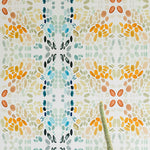 A potted cactus stands in front of a wall papered in a painterly grid print in blue, gray, and orange on a cream field.