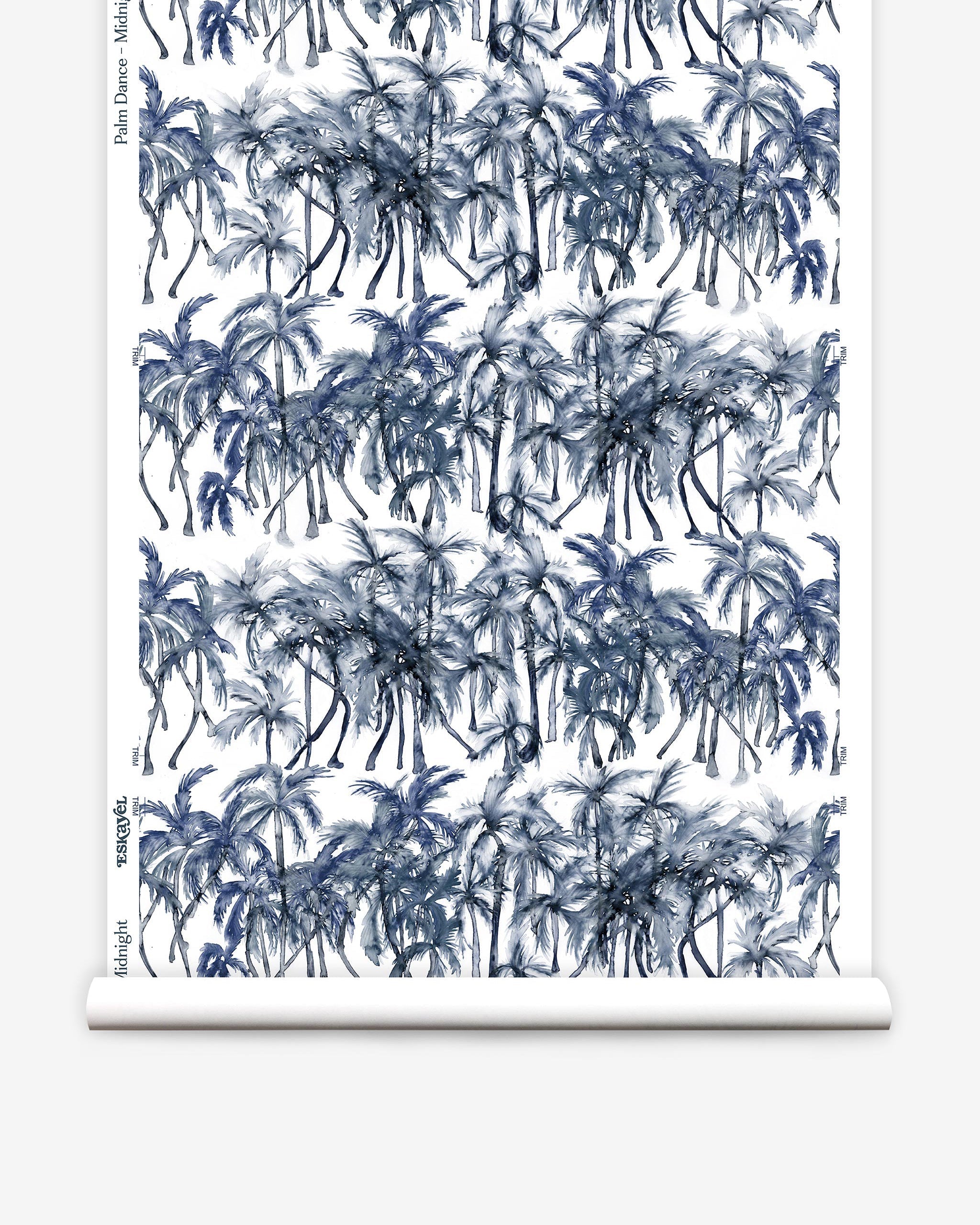 Partially unrolled wallpaper yardage in a painterly palm tree stripe print in navy, gray and white.