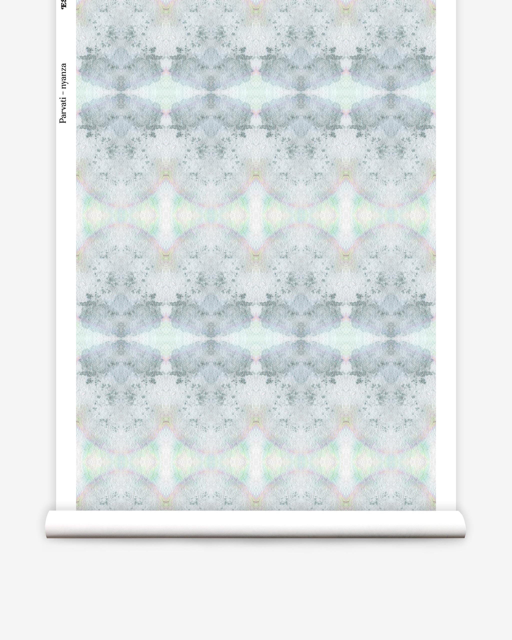 Partially unrolled wallpaper yardage in a watercolor ink blot pattern in shades of gray, green and pink.