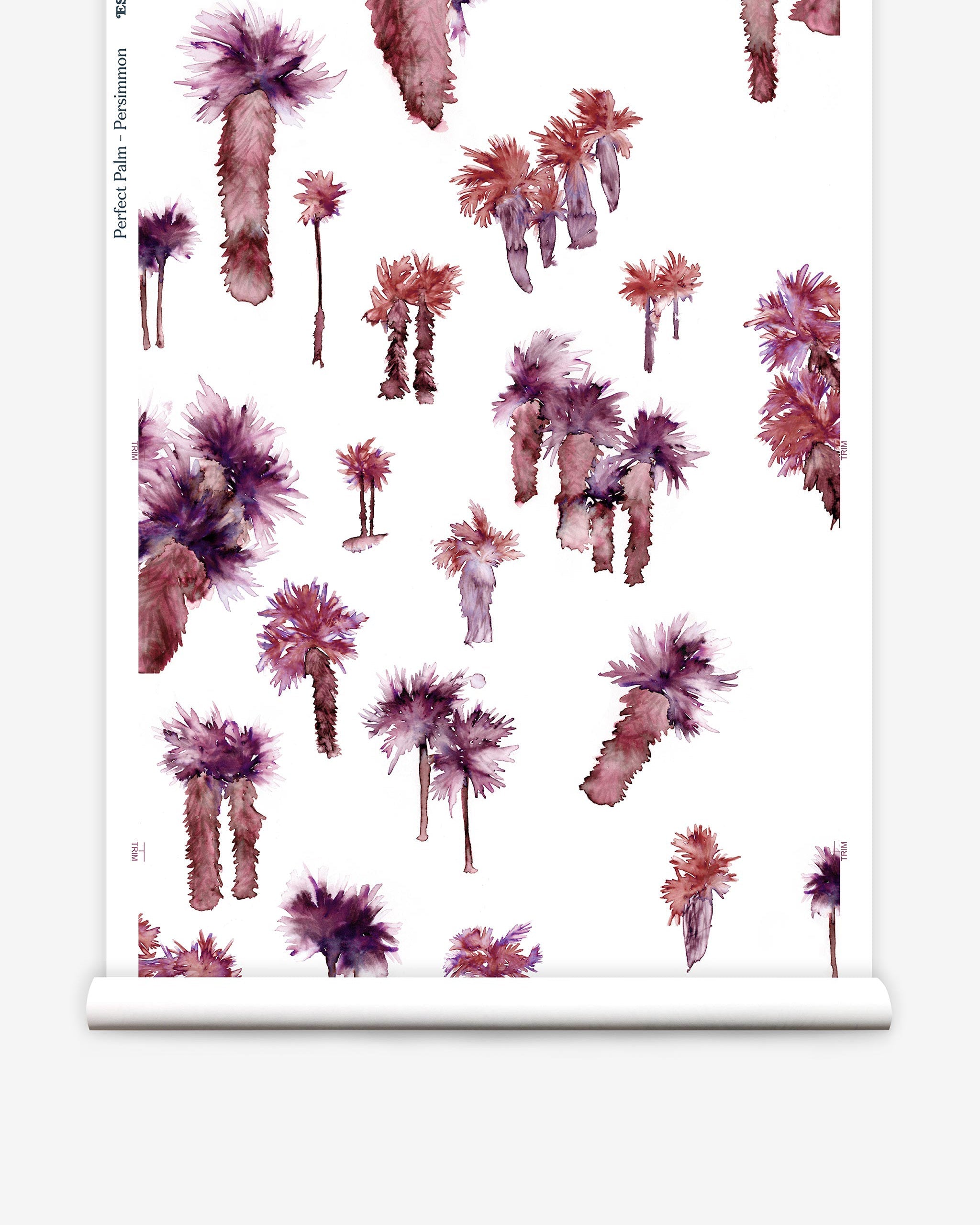 Partially unrolled wallpaper yardage in a playful palm tree print in shades of purple and red on a white field.