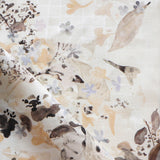 Floral patterned fabric with leaf and floral designs on a white background