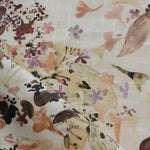Floral patterned fabric with a beige background