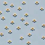 Detail of wallpaper in a minimal floral print in shades of gold, white and navy on a blue field.