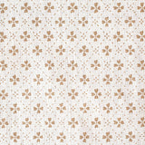 Detail of fabric in a dainty floral lattice print in tan on a cream field.