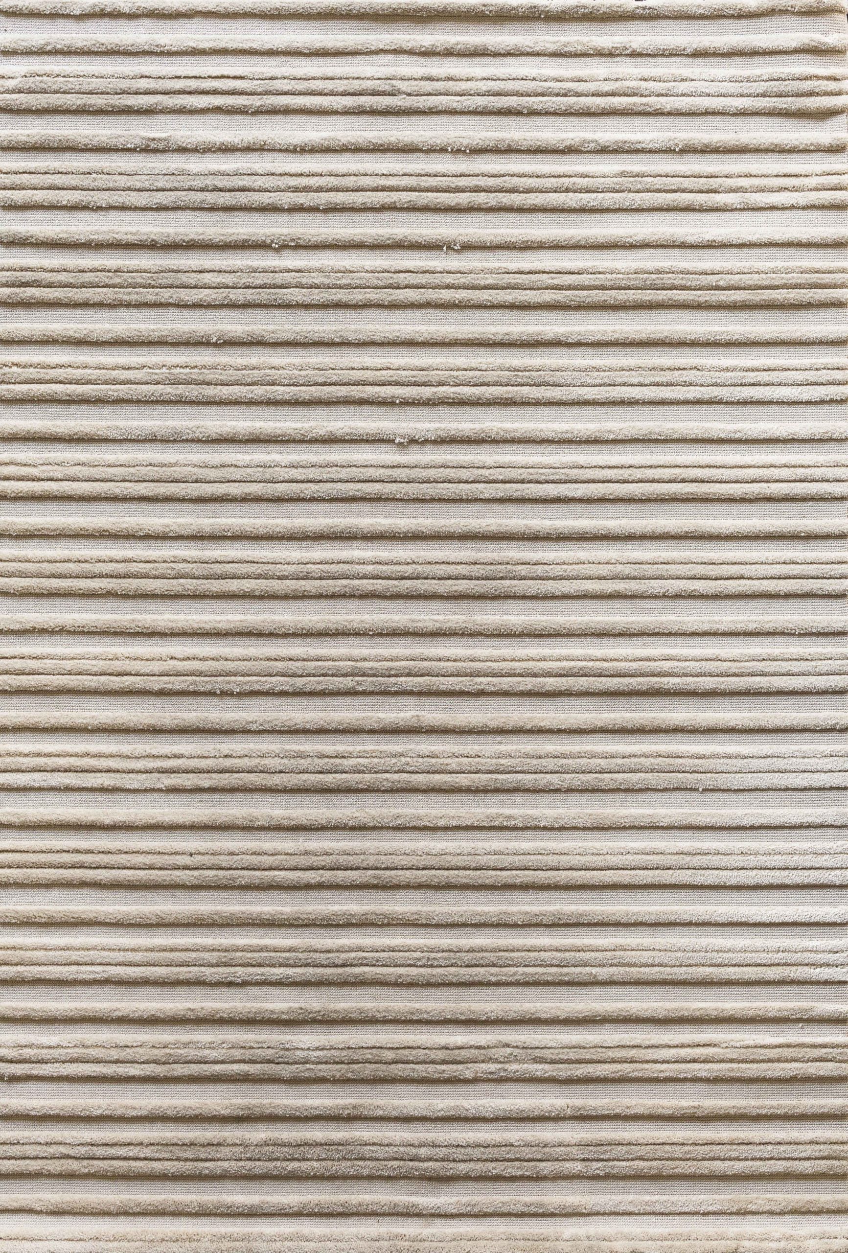 Textured carpet with horizontal loop and raised cut pile stripes in ivory.