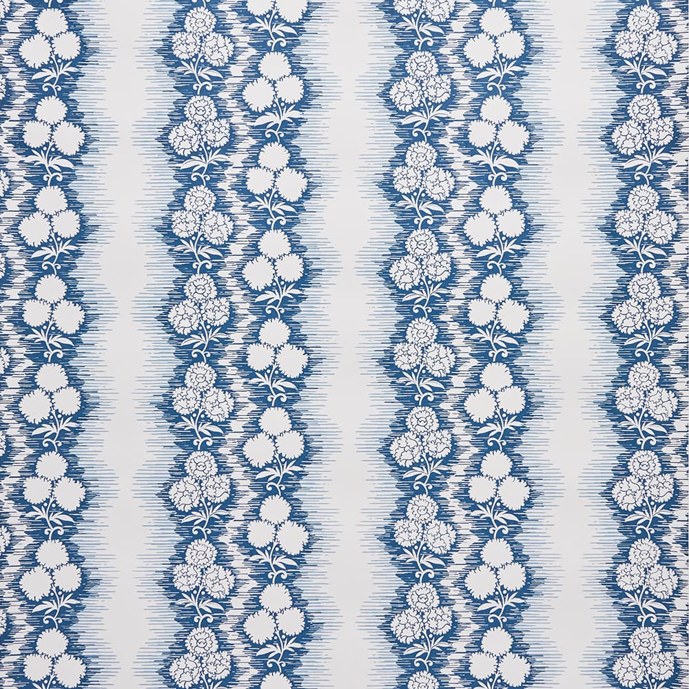 Patterned wallpaper with blue and white floral design on a striped background