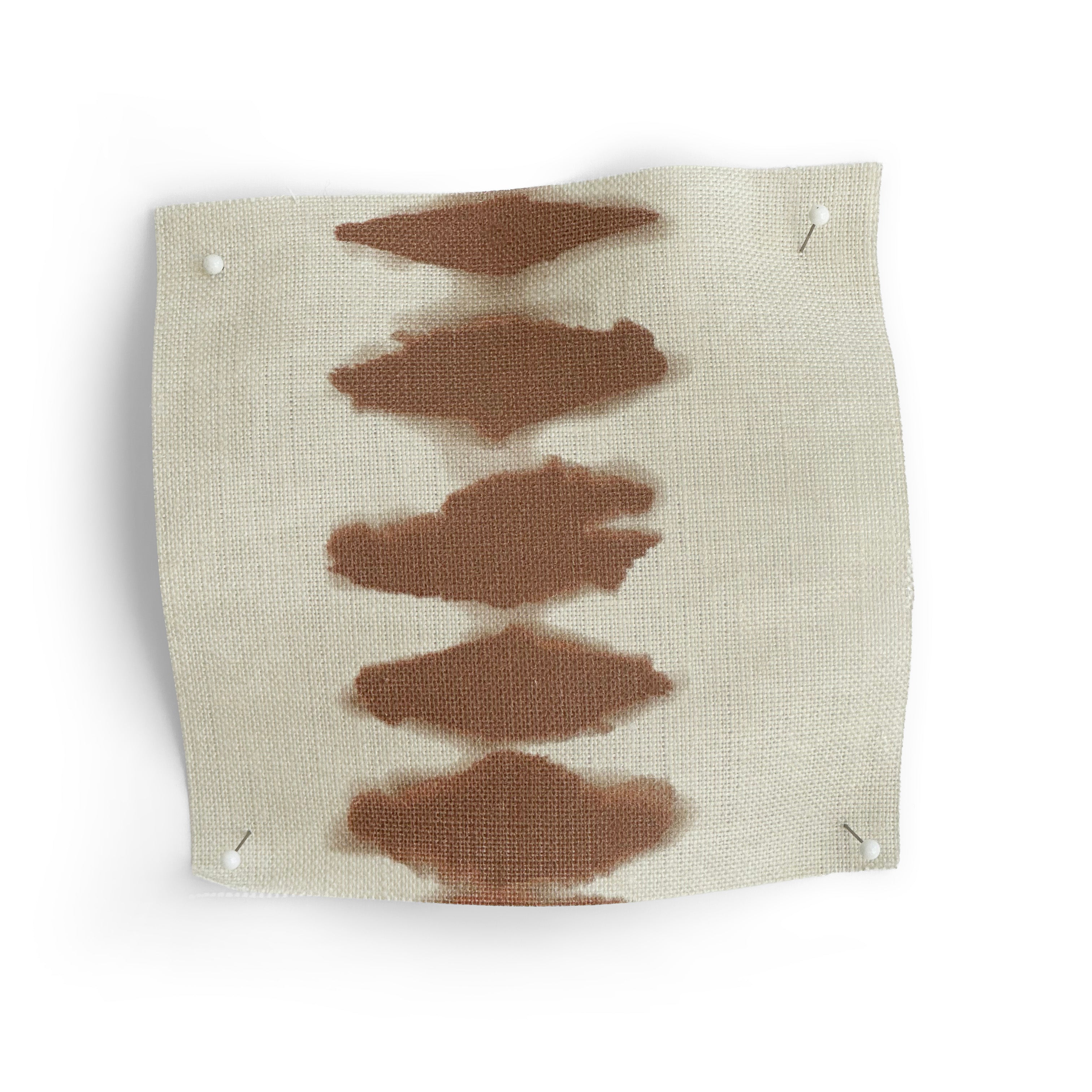 Fabric swatch with brown abstract patterns on a white background