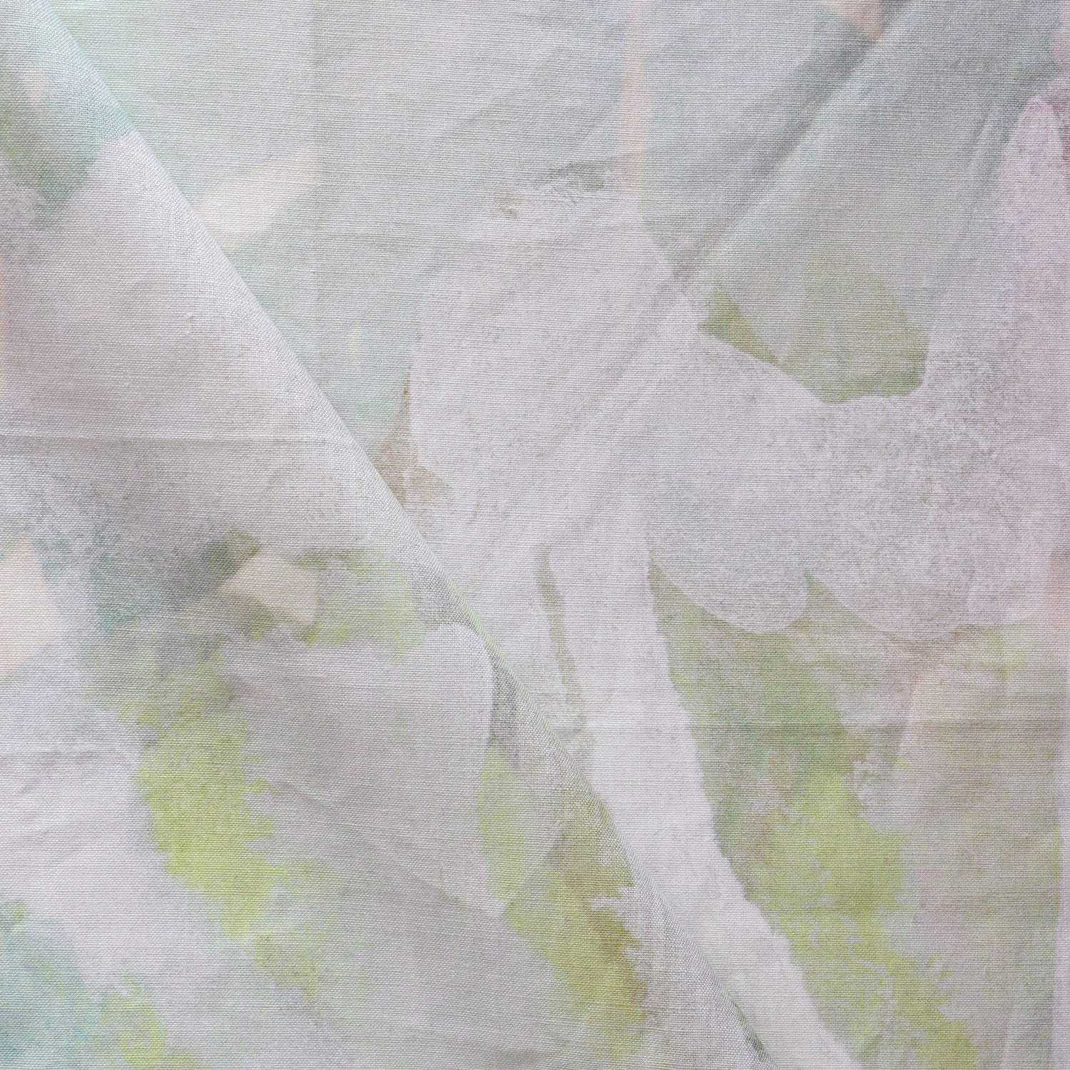 Close-up of a textured fabric with green and white patterns