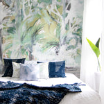 Bedroom with tropical mural wall and decorative pillows
