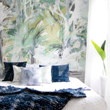 Bedroom with tropical mural wall and decorative pillows