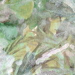 Close-up of green watercolor leaves on a textured surface