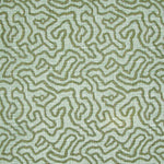 Printed fabric in a meandering hand drawn line pattern in green on an aqua field.