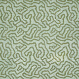 Printed fabric in a meandering hand drawn line pattern in green on an aqua field.