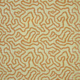 Printed fabric in a meandering hand drawn line pattern in orange on a green field.