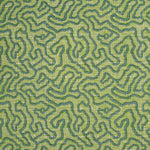 Printed fabric in a meandering hand drawn line pattern in teal on a bright green field. 