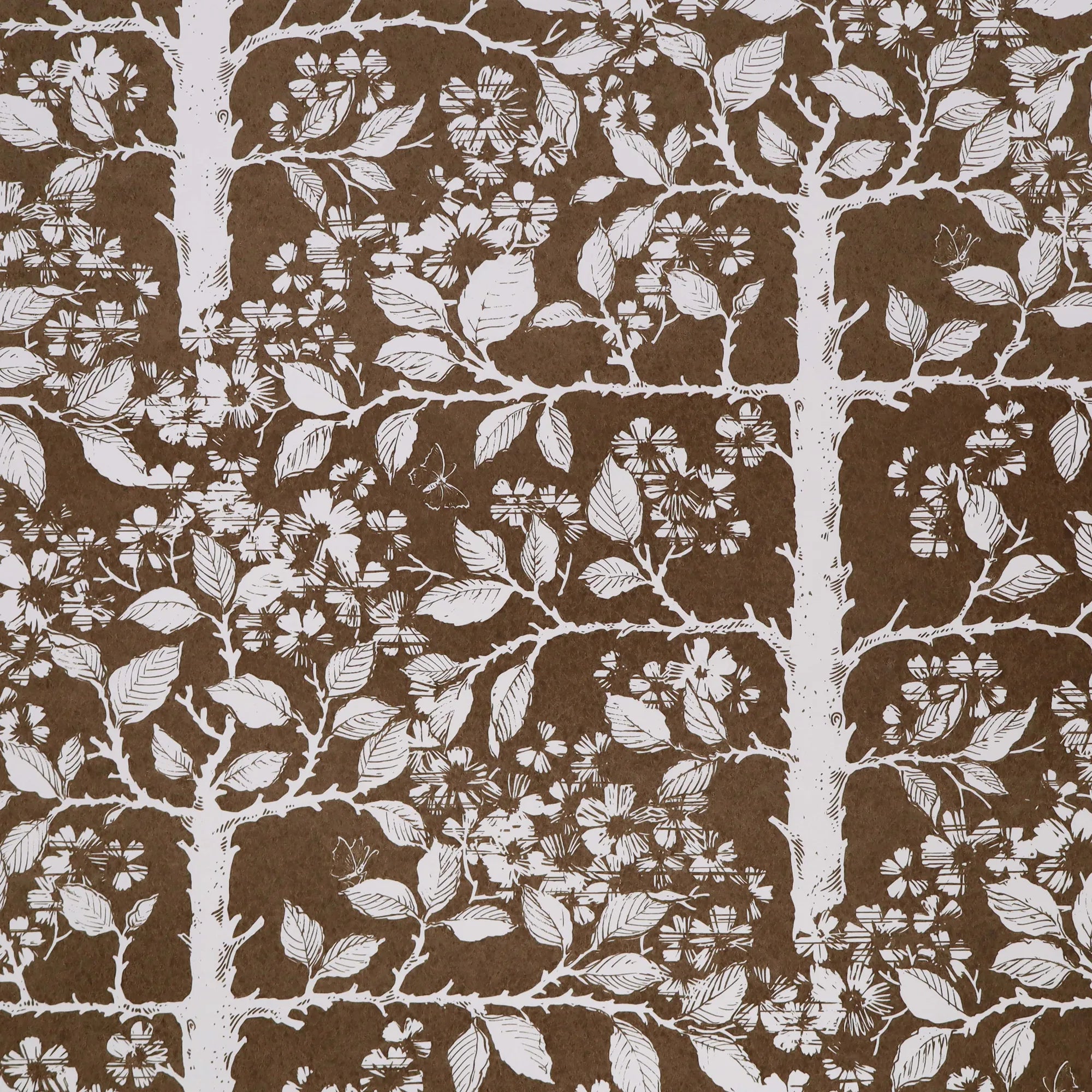 Wallpaper with tree and leaf pattern in white on a brown field. 