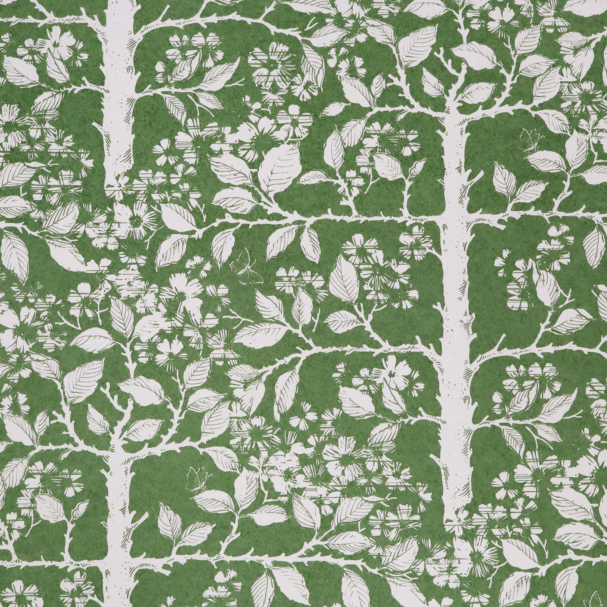 Wallpaper with tree and leaf pattern in white on a green field. 