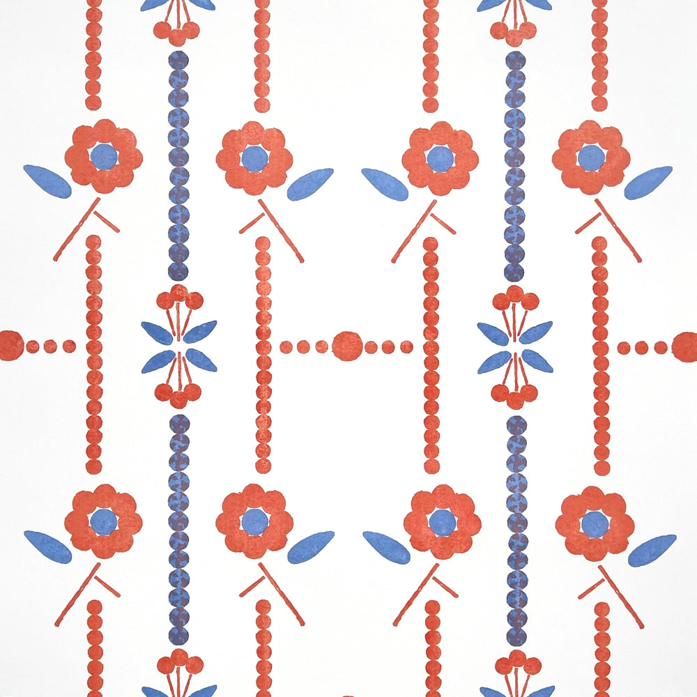 Printed wallpaper in a small scale floral stripe in red and blue.